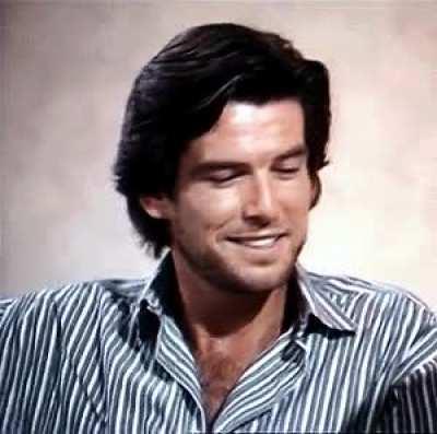 Pierce Brosnan in 1985 was quite the sight - He might just have been the most attractive man alive. at the time. I see a mixture of Patrick Dempsey, the Hemsworth brothers, Tom Cruise and Prince Eric from the Little Mermaid. What a smokestack.
