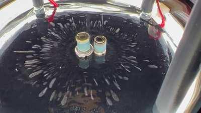 My son and I built a cloud chamber particle detector. This is our sample of Plutonium in it.