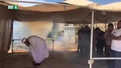 Israel military forces tear gas at Palestinian civilians while praying.