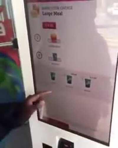 Kid knocks out a McD kiosk