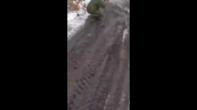 Russian soldier shoots a mine.