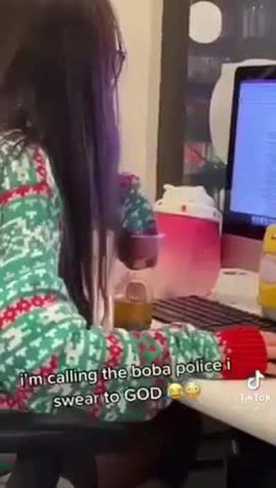 Girl drinks boba with her sleeve