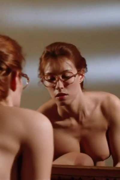 Busty nerdy redhead going topless!