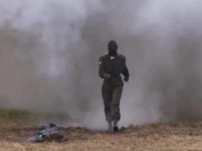 Russian combat suit tested. Walking through explosions.