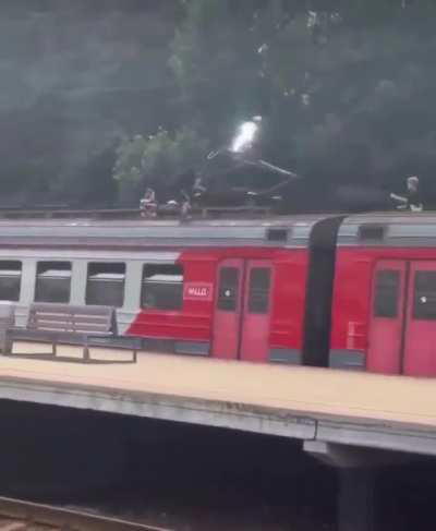 kids casually playing witg a high voltage train thingie