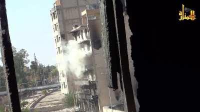 Al-Nusra fighters use the timer on a microwave oven to fire a rocket at Regime positions; Deir Ez-Zour Syria 2013