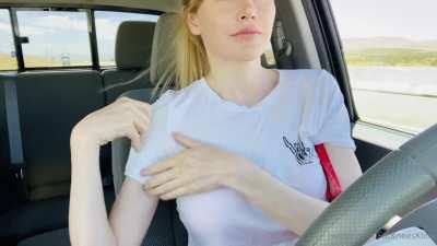 Taking bra off while driving at high speed without hands on steering wheel
