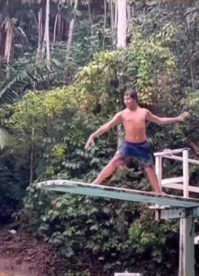 Showing his dancing skills on a diving board