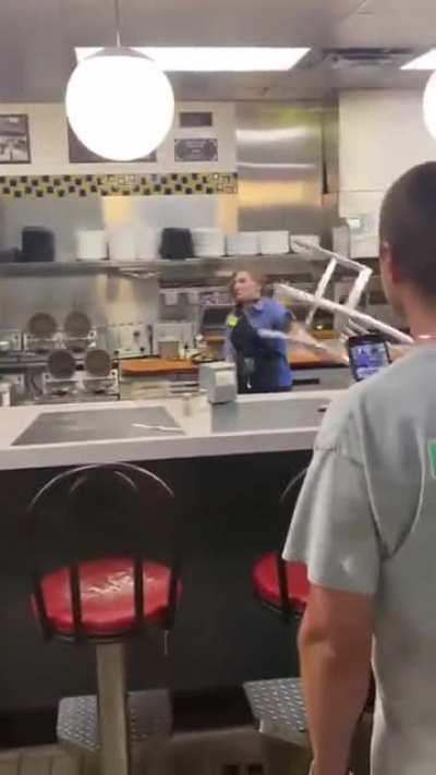 Girl working at Fast food joint blocks chair throw