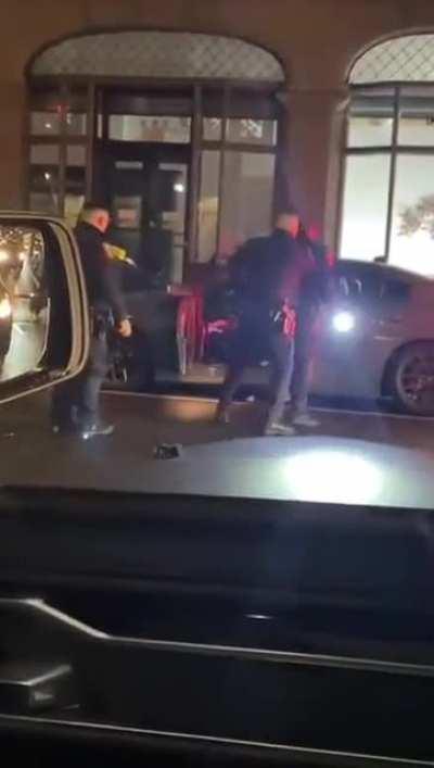 Dude fights off 3 cops at once, then drives off in a car while being tazed
