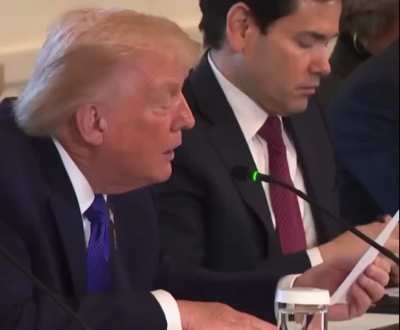 Rubio hands Trump a private note, Trump proceeds to read out loud.