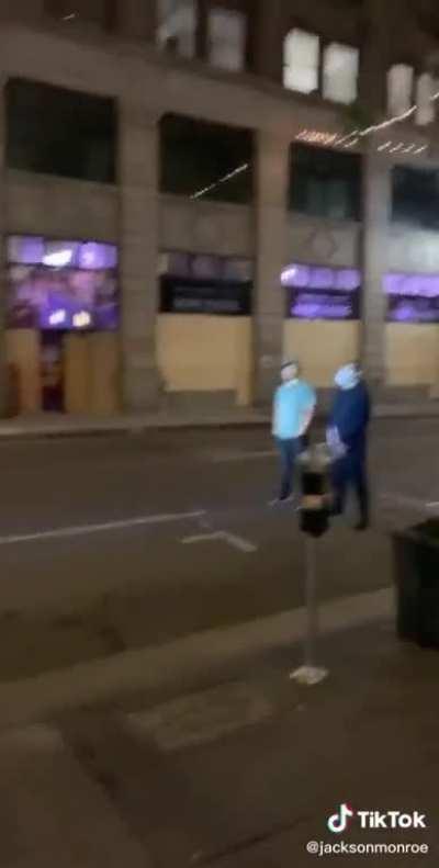 Two dudes having a peaceful conversation 50ft from cops. And guess what happens