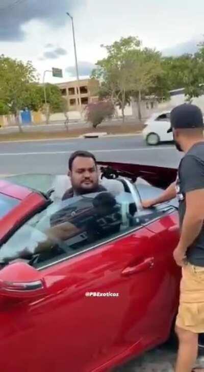 Big boy in a tiny car