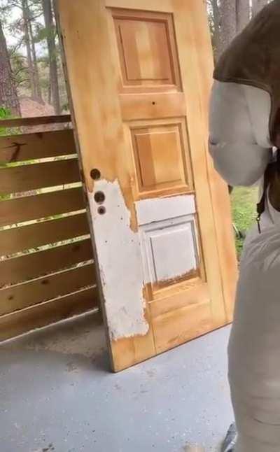 Sandblasting a wooden door