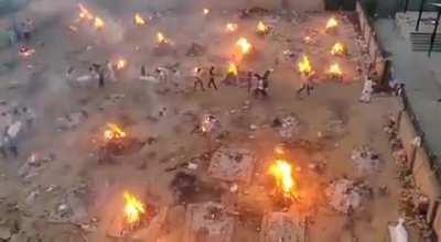 Dead bodies of Covid-19 patients being cremated at a crematorium in Northeast Delhi, India.