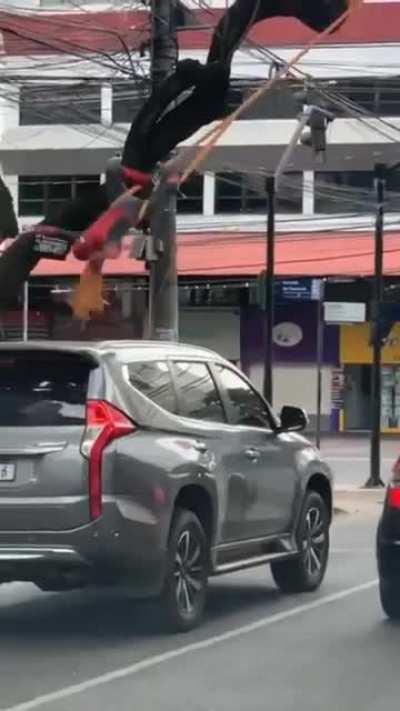 This street performer is putting up a million dollar show, and showing a great example of trust in that tree. The Spiderman suit? Just a bonus.