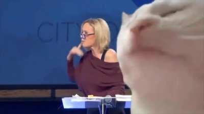 Trump voodoo high priestess chanting in tongues. Someone put a lit techno cat over it. Makes it much better.