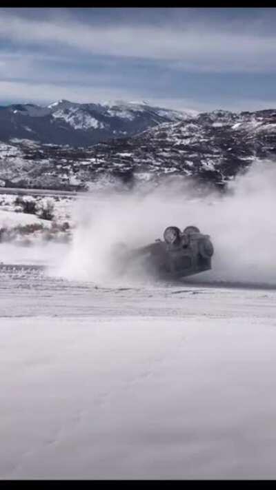 Someone flips their G Wagon while trying to slide it in the snow