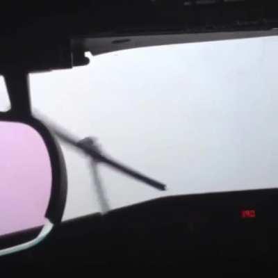 runway disappears in rainstorm right as the plane is about to land