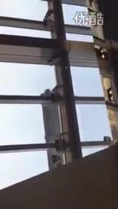 Shanghai Window Cleaners Blowing in Strong Winds (92 floors up)