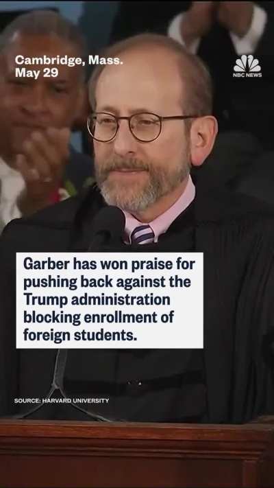 Harvard president receives standing ovation during commencement. 