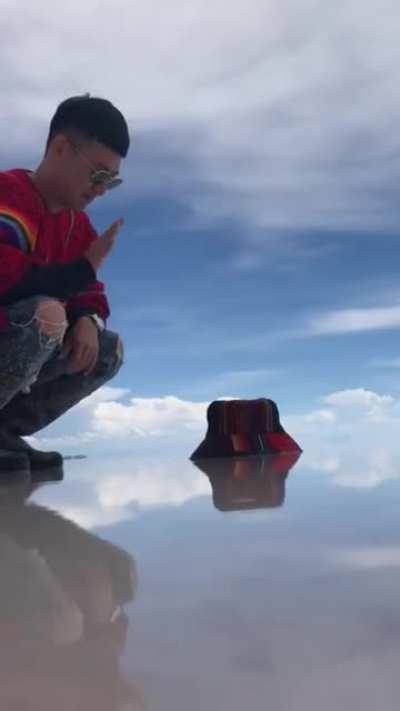 Dude catches some little munchkins on the beach.
