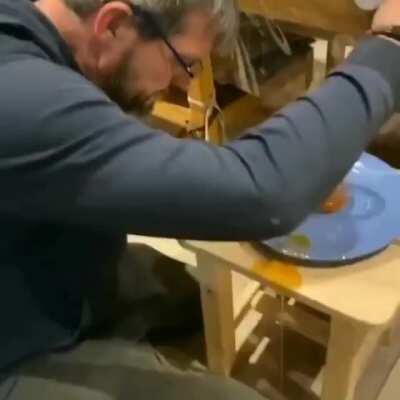 Filling a jar of syrup