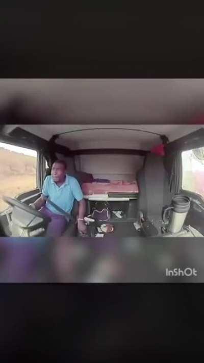 Highway robbers take shots at a moving truck - driver does well to keep it steady!