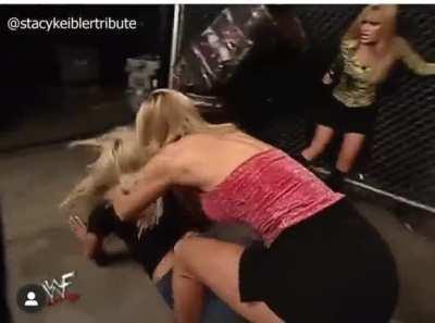 Stacy and Torrie backstage cat fight - Stacy trying to rip her top off