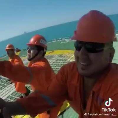 Parachuting onto a moving ship with a helipad