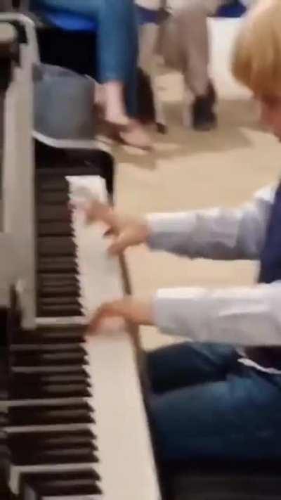 This five year old performing a Mozart piece at a music competition, all while being unable to read
