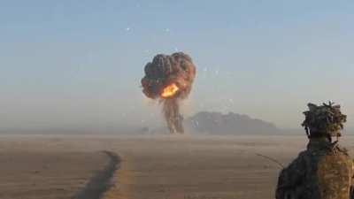 Visible delayed shock-wave from bomb.