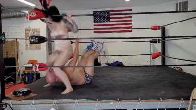 Kisa Kicks femdom wrestling and ballbusting in a shiny new Onsie!