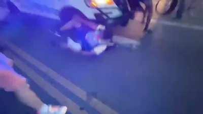 Police in detroit hitting protesters.