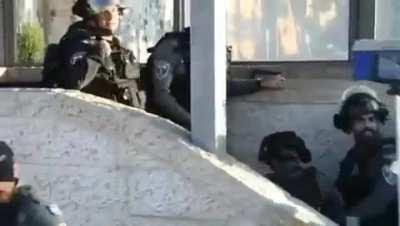 Israeli occupation soldiers spraying a Palestinian young man with pepper gas and brutally beating him after detaining the young man at Damascus Gate in occupied city of Jerusalem, today.