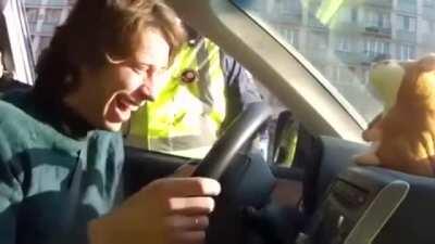 Man with toy that repeats words gets pulled over and can't keep it together
