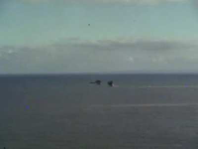 Original color footage of German shells fired from the French coast targeting British coastal shipping near Dover circa 1941