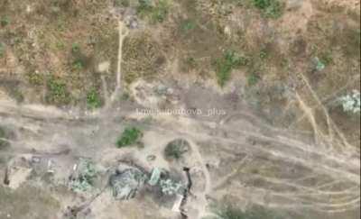 Ukrainian drone drops a munition on two Russian soldiers near a trench, one dives into it and is protected, the other attempts to run and is wounded, they end up bumping into each other in a comical 'three stooges' way