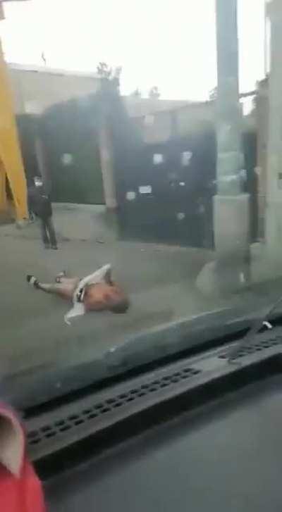 Alternative view of the robber after getting thrown away from the bus