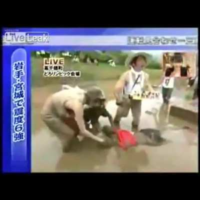 Japanese TV host Tetsushi Yanagida breaks his neck during a live TV show when he decides to dive head-first into shallow mud, permanently paralyzing himself as everyone around him thinks he's joking around, laying face down in the mud.