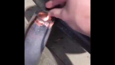 Putting unknown black powder in vase and lighting it on fire