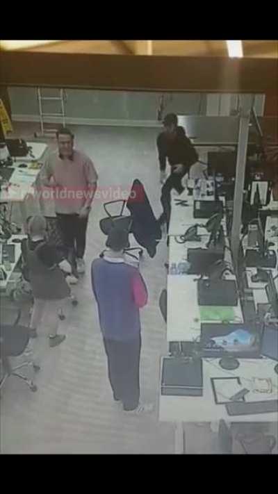 Man recognizes a woman having a seizure and catches her before she hits the ground