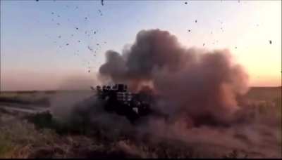 Ukrainian soldiers escaping their vehicle seconds before an FPV drone impacts it