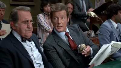 This is peak Moore. Quick thinking, suave, and sly. (He swaps the eggs).