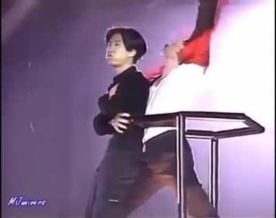 Man jumps on a crane with Michael Jackson during a show