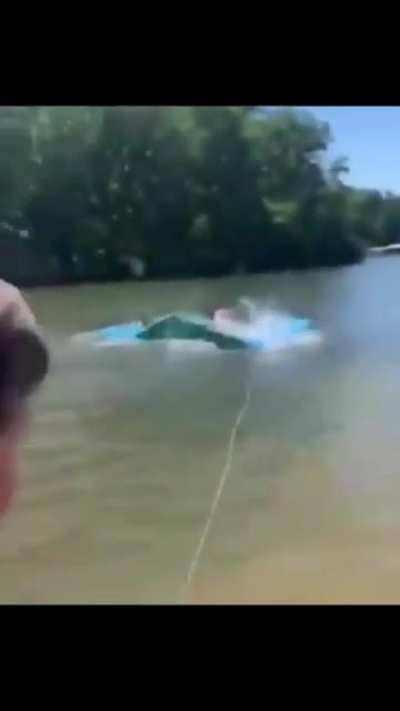 A young courageous man saving people’s lives from a snake.