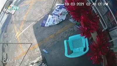 Military/police stealing/looting beer and drinks from a shop.