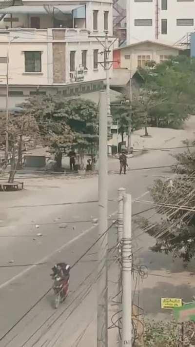 Motorcyclist in Myanmar Narrowly Escapes Death when a Soldier attempts to Shoot Him