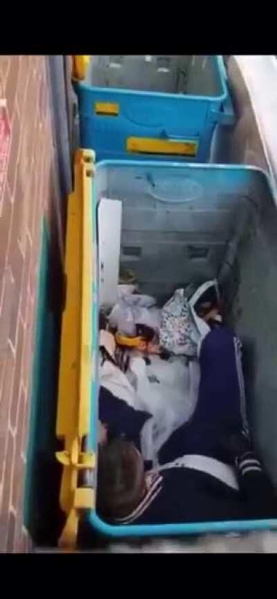 Some bloke lying in a bin talking to himself after doing pills & powder