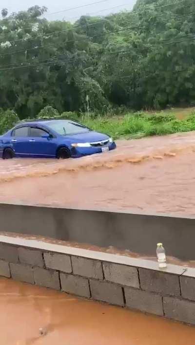Idiot driving through flooded street [OC]